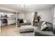 Inviting living room features modern gray sofas, a patterned ottoman, and a decorative ceiling light at 92 Saint Charles Ne Ave, Concord, NC 28025
