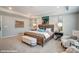 Bright bedroom featuring a wooden bed frame, carpeted floors, tray ceiling, and complementary wall art at 9945 Cask Way, Huntersville, NC 28078