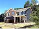 Beautiful two-story home with a two-car garage and welcoming covered porch at 9945 Cask Way, Huntersville, NC 28078