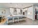 Bright kitchen with a large island, pendant lighting, breakfast bar, and modern appliances at 9945 Cask Way, Huntersville, NC 28078