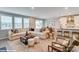 Open-concept living room with kitchen and dining area, perfect for entertaining at 9945 Cask Way, Huntersville, NC 28078