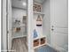 Welcoming mudroom with storage bench, decor, and a peek into the pantry at 9945 Cask Way, Huntersville, NC 28078