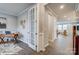 Cozy home office with wood floors, neutral walls, and an open doorway to the living room at 9945 Cask Way, Huntersville, NC 28078