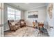 Bright home office features decor, hardwood floors, a desk, and a large window for natural light at 9945 Cask Way, Huntersville, NC 28078