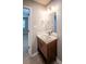 Stylish bathroom vanity with modern light fixtures and updated mirror, offering a fresh feel at 1004 Johnson St, Charlotte, NC 28206