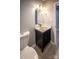 A bathroom featuring a modern vanity, mirror with lighting, and tile flooring at 1004 Johnson St, Charlotte, NC 28206