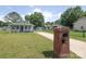 View of a cozy home featuring a brick mailbox, well-kept lawn, and inviting curb appeal at 1004 Johnson St, Charlotte, NC 28206