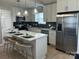 Bright kitchen with a center island, stainless steel appliances, and elegant pendant lighting at 1004 Johnson St, Charlotte, NC 28206