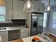 Bright kitchen featuring modern white cabinets, stainless steel appliances, and stylish pendant lighting at 1004 Johnson St, Charlotte, NC 28206
