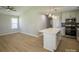 Open-concept kitchen featuring a center island with pendant lights and stainless steel appliances at 1004 Johnson St, Charlotte, NC 28206