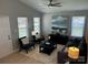A cozy living room with neutral walls, ample seating, and bright natural light at 1004 Johnson St, Charlotte, NC 28206