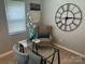 Inviting office space features a modern glass desk, comfortable chair, and stylish decor with natural light at 1004 Johnson St, Charlotte, NC 28206