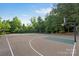 Community basketball court surrounded by trees and landscaping at 1014 Harrogate Ln, Matthews, NC 28104
