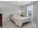 Comfortable bedroom with neutral decor, soft bedding, and natural light at 1014 Harrogate Ln, Matthews, NC 28104