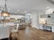 Bright eat-in kitchen featuring stainless appliances, white cabinetry, granite countertops, and breakfast nook at 1014 Harrogate Ln, Matthews, NC 28104