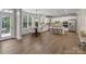 Bright eat-in kitchen featuring stainless appliances, white cabinetry, granite countertops, and breakfast nook at 1014 Harrogate Ln, Matthews, NC 28104