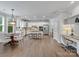 Bright eat-in kitchen featuring stainless appliances, white cabinetry, granite countertops, and breakfast nook at 1014 Harrogate Ln, Matthews, NC 28104