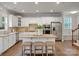 Bright kitchen featuring stainless appliances, white cabinetry, granite countertops, and a center island at 1014 Harrogate Ln, Matthews, NC 28104