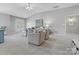 Inviting living room featuring neutral colors, vaulted ceilings, and lots of light at 1014 Harrogate Ln, Matthews, NC 28104
