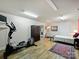Basement features a workout area, sitting area, and bedroom combo at 10545 Mount Holly Huntersville Rd, Huntersville, NC 28078
