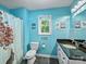 Charming bathroom featuring colorful butterfly shower curtain and granite countertop at 10545 Mount Holly Huntersville Rd, Huntersville, NC 28078