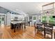 Bright kitchen featuring white cabinetry, stainless appliances, and a spacious island with granite countertop and bar seating at 10545 Mount Holly Huntersville Rd, Huntersville, NC 28078