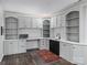 Kitchenette features white and gray cabinets, sleek black hardware, and a black sink at 10545 Mount Holly Huntersville Rd, Huntersville, NC 28078