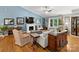 Cozy living room featuring a fireplace, neutral decor, large windows, and vaulted ceiling at 10545 Mount Holly Huntersville Rd, Huntersville, NC 28078