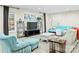 Bright and airy living room boasts modern decor, comfortable seating, and neutral tones at 10545 Mount Holly Huntersville Rd, Huntersville, NC 28078