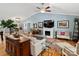 Bright living room with hardwood floors, fireplace, neutral furniture, and vaulted ceiling at 10545 Mount Holly Huntersville Rd, Huntersville, NC 28078