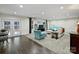 Spacious living room with neutral carpeting, modern furniture, and bright lighting at 10545 Mount Holly Huntersville Rd, Huntersville, NC 28078