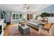Spacious living room with neutral decor, fireplace, and view into the entry area and hardwood floors at 10545 Mount Holly Huntersville Rd, Huntersville, NC 28078