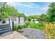 A charming backyard featuring a deck, landscaping, storage shed, and scenic views at 109 Ashley St, Shelby, NC 28150