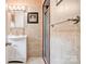 Bathroom showcasing tiled walls, modern vanity, and a glass-enclosed shower stall at 109 Ashley St, Shelby, NC 28150