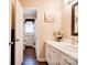 Bathroom with tile floor, decorative mirror, and shower/tub with floral shower curtain at 109 Ashley St, Shelby, NC 28150