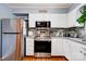 Well-equipped kitchen with stainless steel appliances, granite countertops, and white cabinetry at 109 Ashley St, Shelby, NC 28150