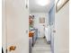 Laundry room with washer, dryer, and built-in storage shelves at 109 Ashley St, Shelby, NC 28150