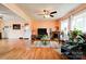 Spacious living room featuring a fireplace, hardwood floors, and large windows offering plenty of natural light at 109 Ashley St, Shelby, NC 28150