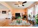 Bright living room with hardwood floors, a fireplace, and a large window providing ample natural light at 109 Ashley St, Shelby, NC 28150