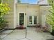 Serene back patio with dining set, perfect for outdoor relaxation and entertaining guests at 11121 Sevilla Ct, Charlotte, NC 28226