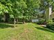 Expansive backyard with lush lawn, mature trees, and plenty of natural light at 11121 Sevilla Ct, Charlotte, NC 28226