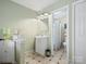 Well-lit bathroom with a vanity, mirror, and accessible shower featuring elegant tile at 11121 Sevilla Ct, Charlotte, NC 28226