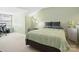 Cozy bedroom with an office area, soft carpet, and natural light from a large window at 11121 Sevilla Ct, Charlotte, NC 28226