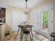 Bright breakfast nook with a small table, chairs, and access to the patio at 11121 Sevilla Ct, Charlotte, NC 28226