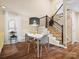 Dining area with modern lighting and a view of the staircase at 11121 Sevilla Ct, Charlotte, NC 28226