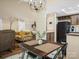Open-concept dining room connected to the kitchen and living room, featuring stylish furnishings at 11121 Sevilla Ct, Charlotte, NC 28226