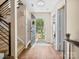 Bright entryway with hardwood floors and an open view of the landscaped front yard at 11121 Sevilla Ct, Charlotte, NC 28226