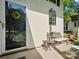 Close-up of front porch featuring a decorative bench and charming details at 11121 Sevilla Ct, Charlotte, NC 28226