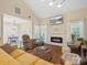 Bright and airy living room featuring fireplace, hardwood floors, and natural light at 11121 Sevilla Ct, Charlotte, NC 28226
