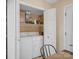 Pantry with shelving and washer/dryer units at 11121 Sevilla Ct, Charlotte, NC 28226